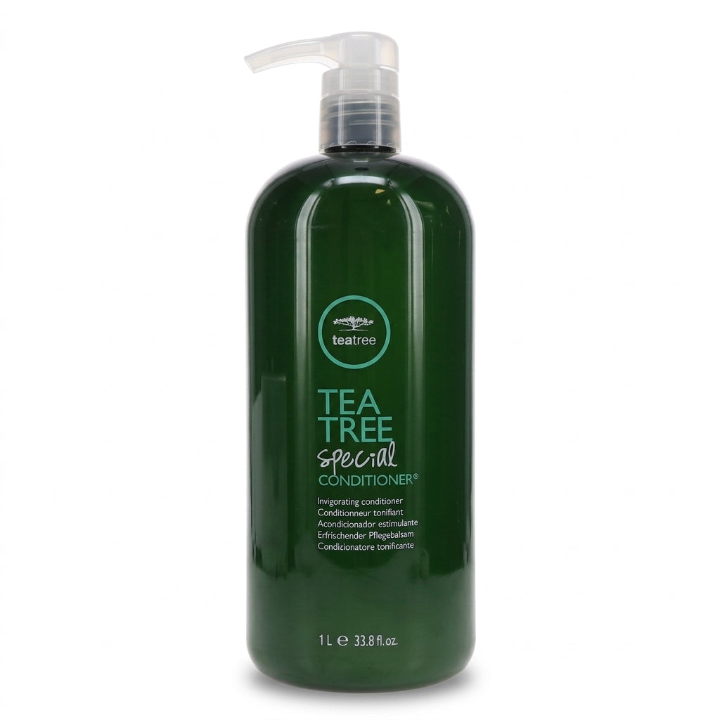 A 1-liter dark green pump bottle of tea tree special conditioner on a plain white background.