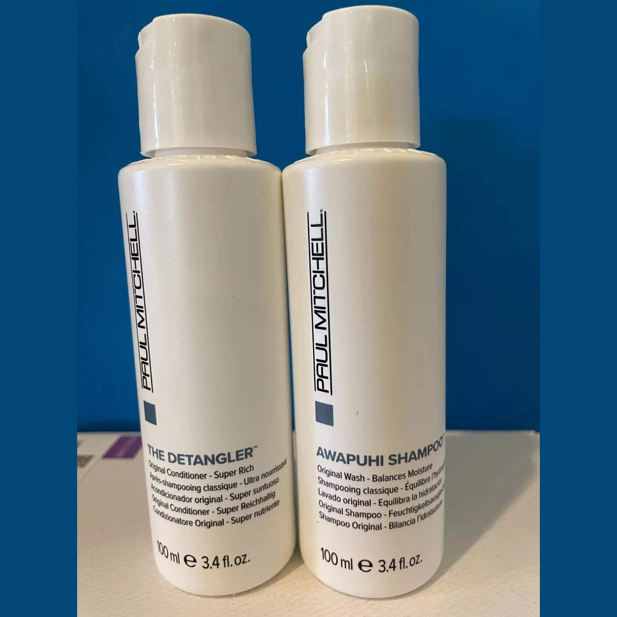 Paul Mitchell Awapuhi Shampoo and Detangler travel duo set in white bottles