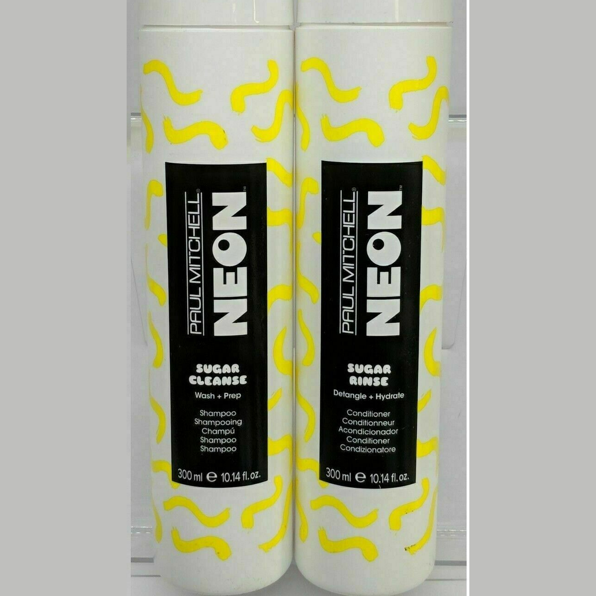 Paul Mitchell Neon Sugar Cleanse & Rinse duo set with white bottles and yellow abstract wave design