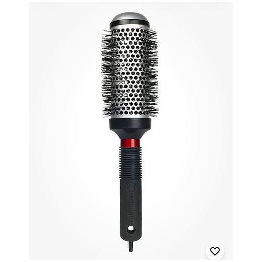 A round hot air brush hair styler with a black and silver barrel, black bristles, a red accent ring, and a black handle with the brand name 'Crown' visible.