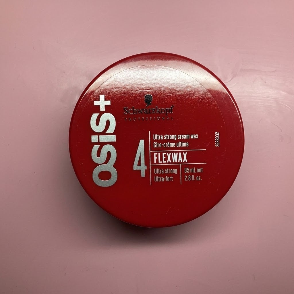 A round red container of Osis+ 4 Flexwax hair wax by Schwarzkopf Professional, shown from a top-down view on a pink background.
